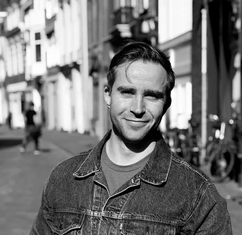 Black-and-white portrait of Maarten van Oostrom